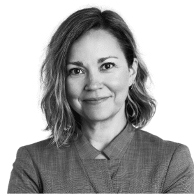 Lindsay Euller, a white woman with short hair smiling.
