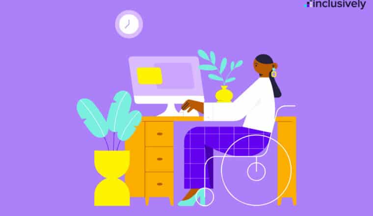 Woman in wheelchair sitting at desk utilizing desktop